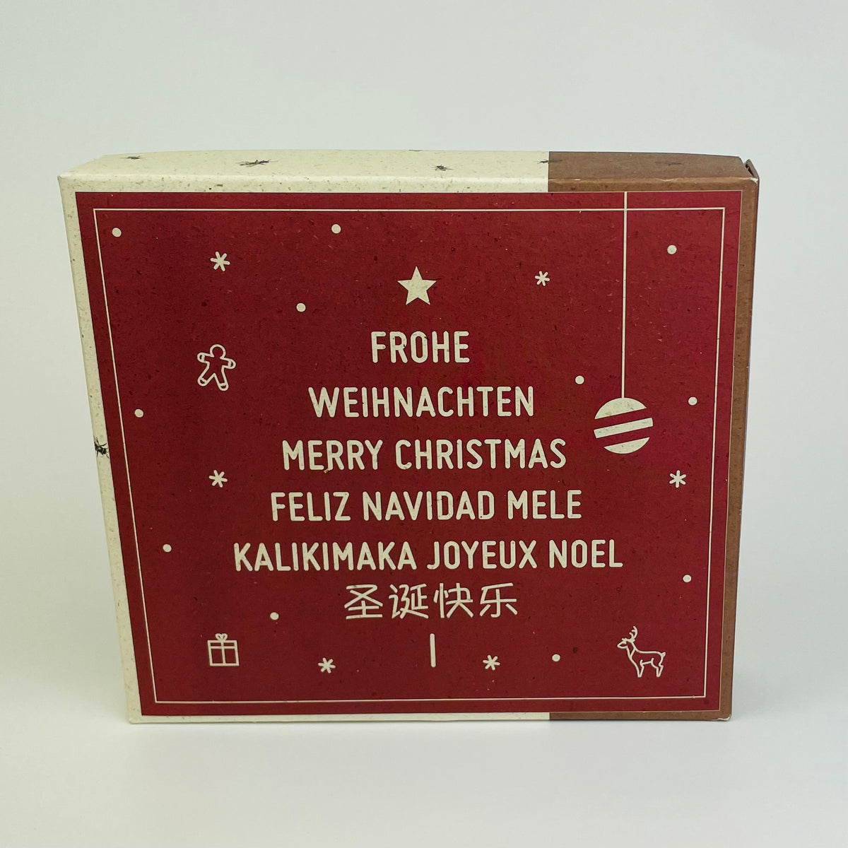 Honigpralinen im Weihnachtsdesign Frohe Weihnachten in mehreren Sprachen 9 Stück