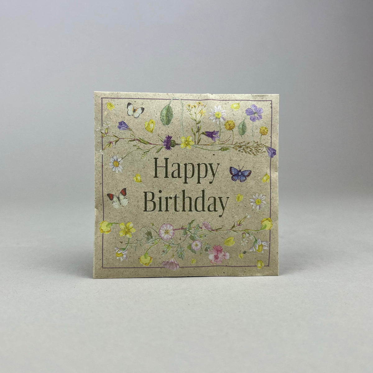 Saattüte mit Blumensaat und Botschaft Happy Birthday mit Blumenmotiv