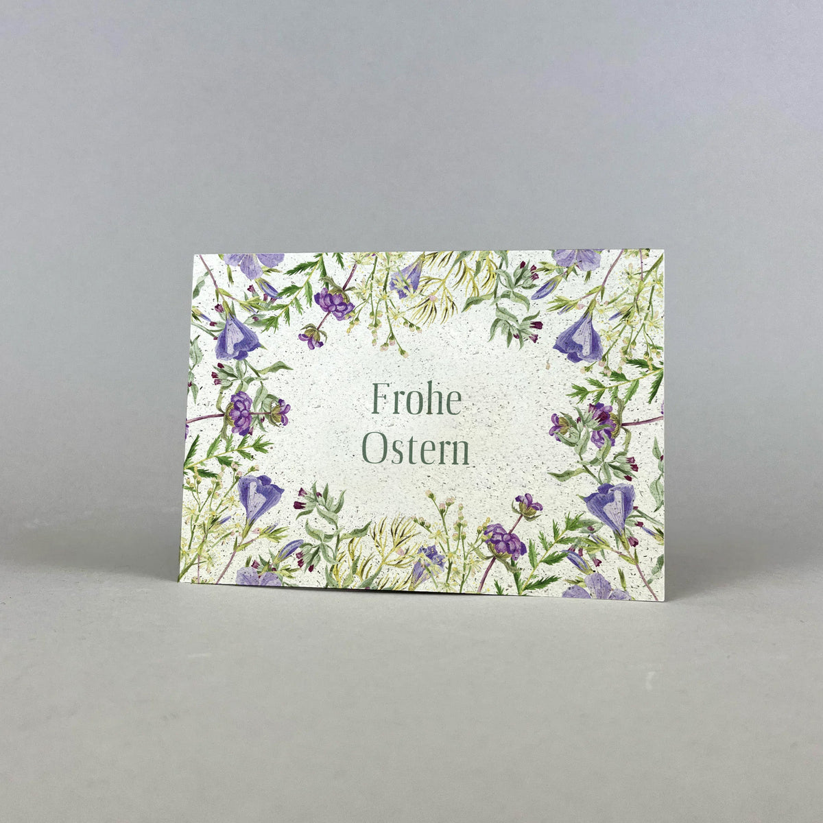 Graspapier Postkarte mit Botschaft Frohe Ostern mit Blumenmotiv