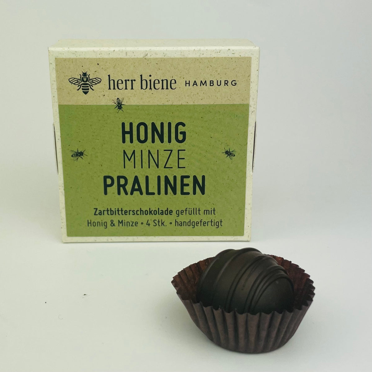 Vier Honigpralinen Minze mit Zartbitterschokolade in Geschenkverpackung