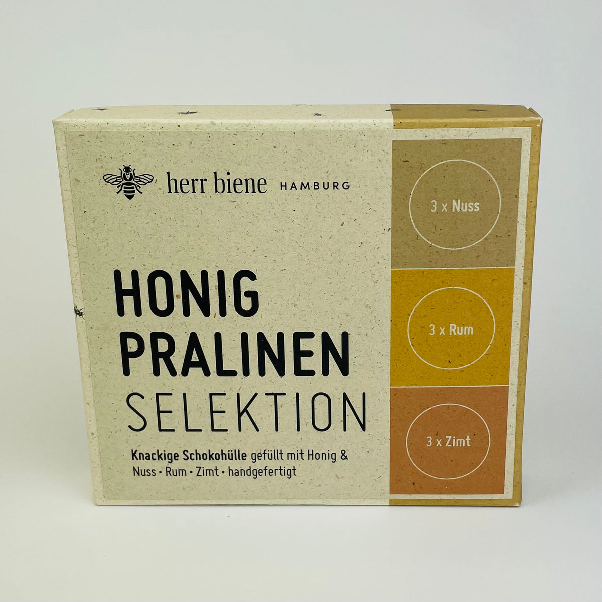 Neun Honigpralinen als Selektion mit Nuss, Rum und Zimt